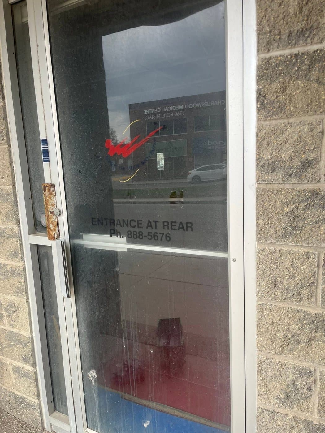 Storefront door before cleaning